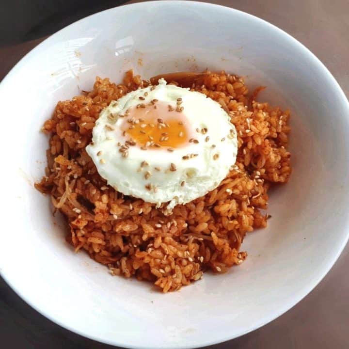 A korean rice dish called Kimchi Fried Rice served with sunny side up egg