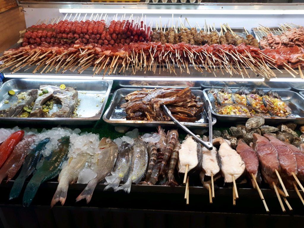 A typical food stall offering fresh seafood and barbecue in Larsian Cebu