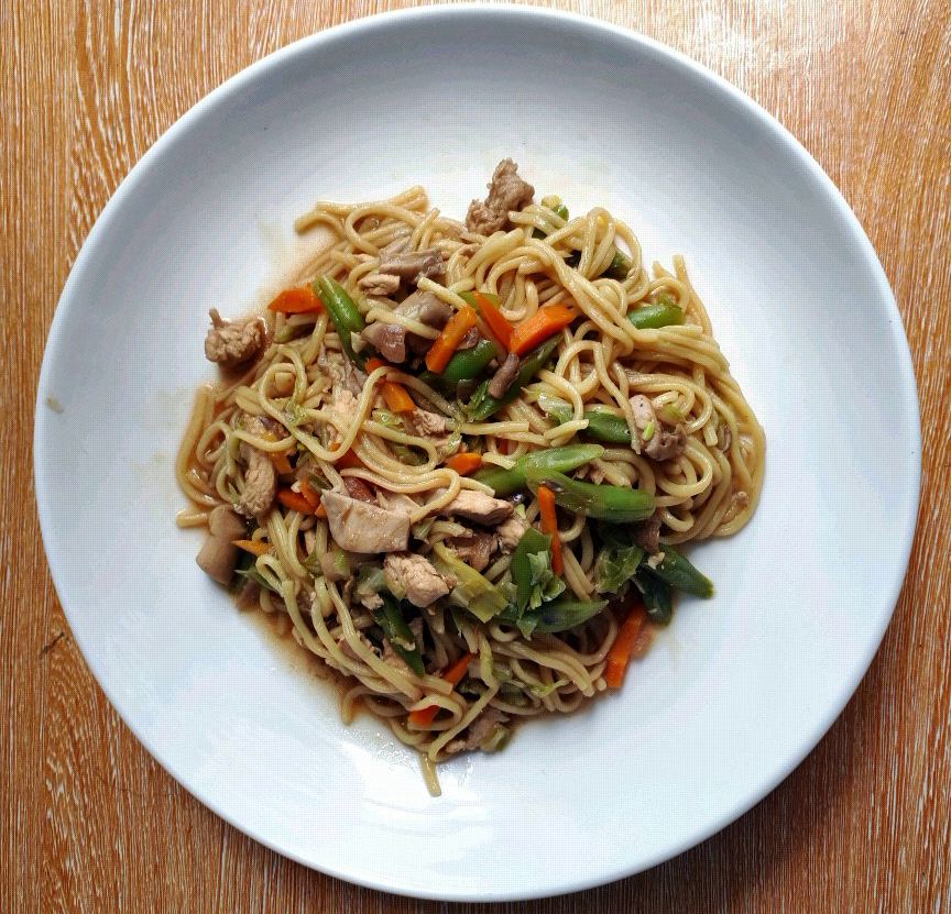 A filipino version of egg noodle mixed with chicken, mushroom, and vegetables called Pancit Canton