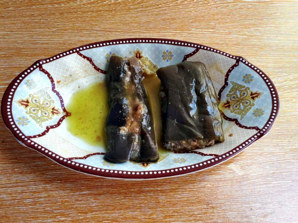 A lebanese pickled eggplant Makdous with olive oil served on a plate