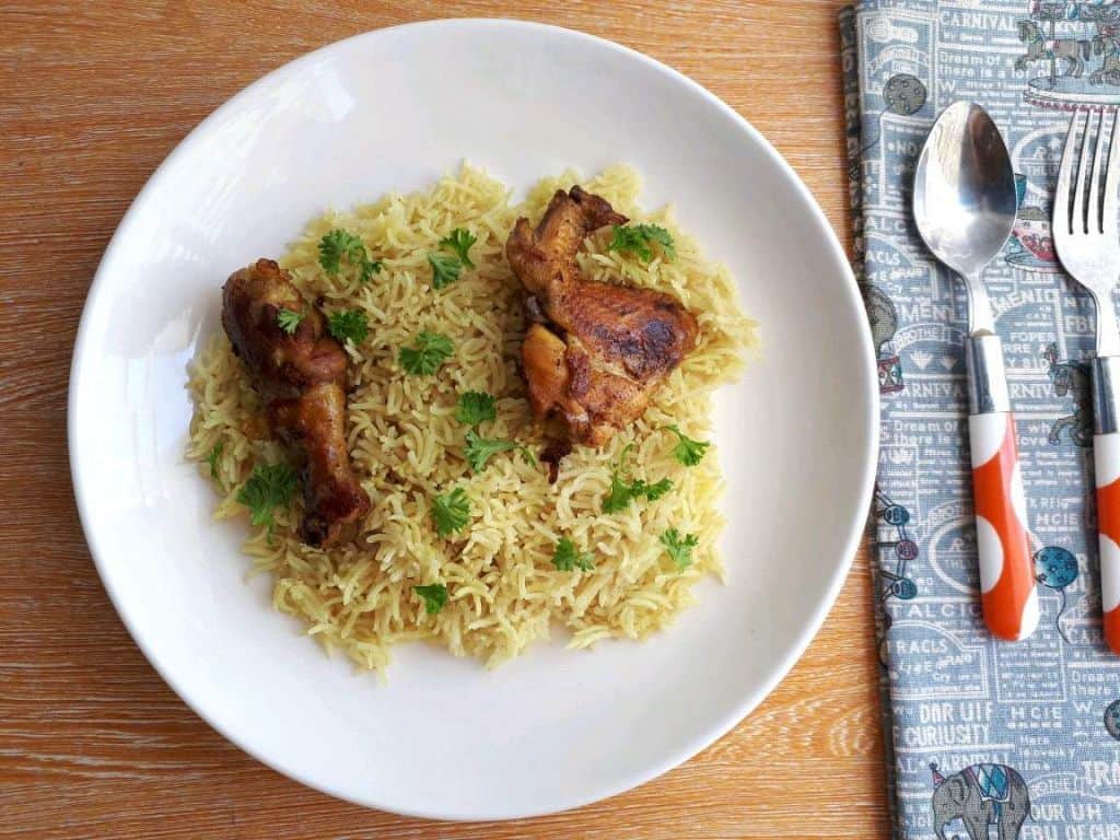 Chicken Majboos Recipe garnished with parsley