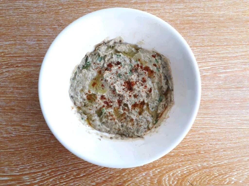 Aubergine Dip (Baba Ganoush) garnished with paprika and drizzle with olive oil.