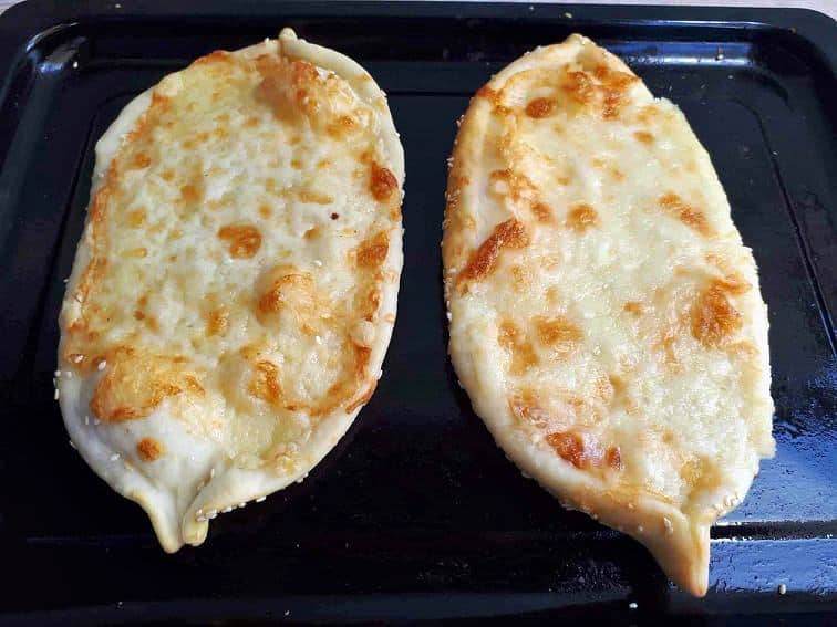 Turkish cheese flatbread called Cheese pide which is topped with Mozzarella and Cheddar Cheese