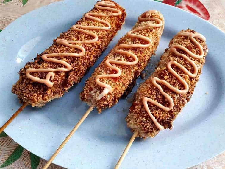 Korean Mozzarella Corn Dog Recipe that is coated in batter & breadcrumb and drizzle with mayo ketchup sauce