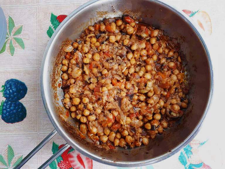 Lebanese Moussaka or Maghmour is a vegan eggplant recipe that is mixed with chickpeas, onion, garlic, and tomatoes.