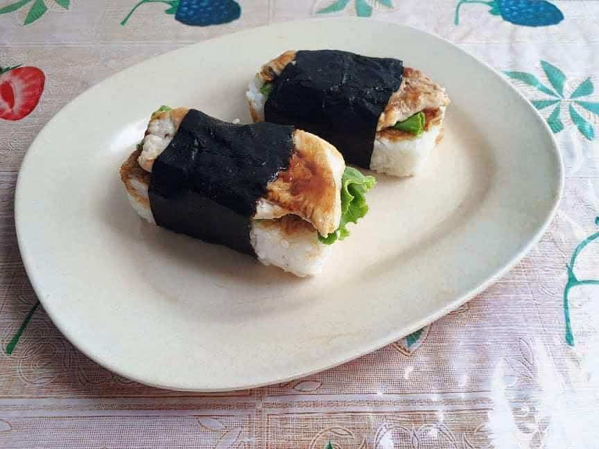 Chicken Musubi mixed with rice, chicken breast and lettuce wrapped in nori sheet