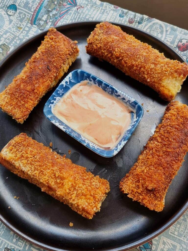 Chicken Bread Roll served with ketchup mayo sauce served on a plate